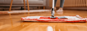 cleaning flooring with a brush