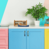 Colourful kitchen with pink, blue and yellow cabinets