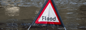 Flood sign in a pool of water