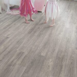 Wide shot of ELV183AP Pebble Oak flooring with children playing