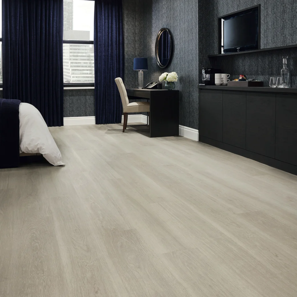 Karndean Grey Brushed Oak flooring in a hotel room
