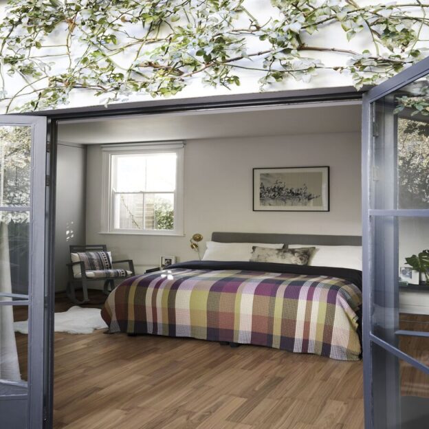 A bedroom with Kahrs Pure Walnut 2-Strip.