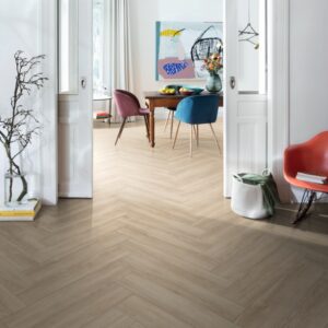 room with a light coloured herringbone flooring