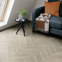 Amtico Heron Oak Parquet flooring in a bedroom