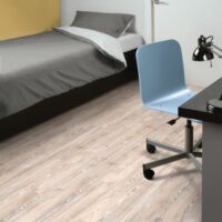 Amtico worn ash flooring in a bedroom
