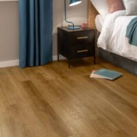 Voyage Oak flooring by amtico in a bedroom