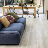 Cove salvaged timber flooring by amtico in a living room