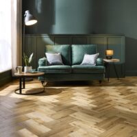 Living room with Matt herringbone flooring by Abingdon flooring
