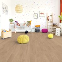 A living room with Elba Oak Gold Laminate flooring